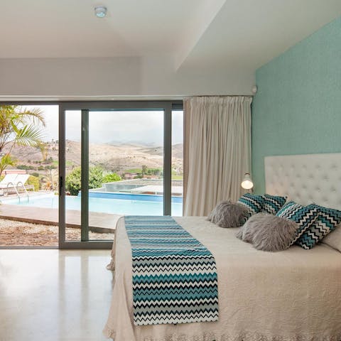 Wake up to views of the the island's mountains out through the bedrooms' glass doors
