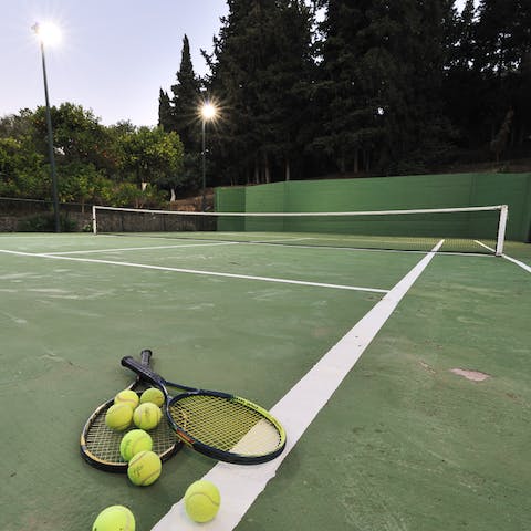 Challenge all comers to a game of tennis on the private court