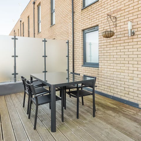 Serve up alfresco meals on the balcony terrace after a day of exploring Cambridge