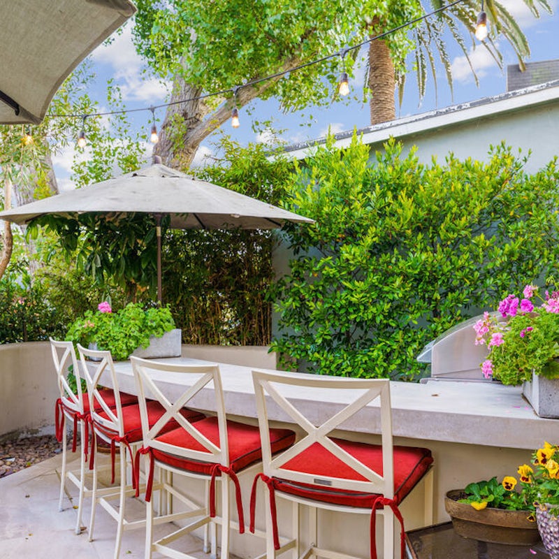 Sit up at the outdoor bar for a round of cocktails at sunset
