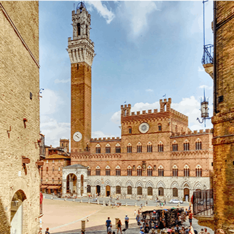 Soak up the beauty of Piazza del Campo, the central square in Siena