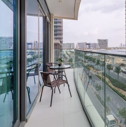 Take in the views over Dubai from the private balcony