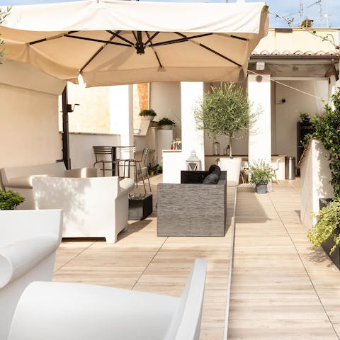 Sip a glass of Italian wine or an Aperol Spritz cocktail up on the residence's rooftop terrace