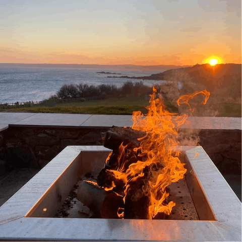 Gather around the fire pit at sunset as the Atlantic Ocean takes on a honey-coloured hue – what a perfect end to the day