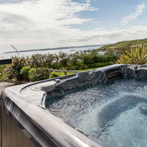 Enjoy a glass of Cornish fizz in the jacuzzi