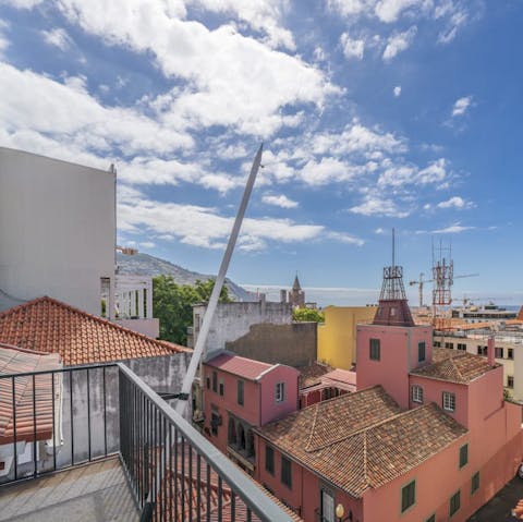 Drink up the swoon-worthy views of Funchal from your private balcony