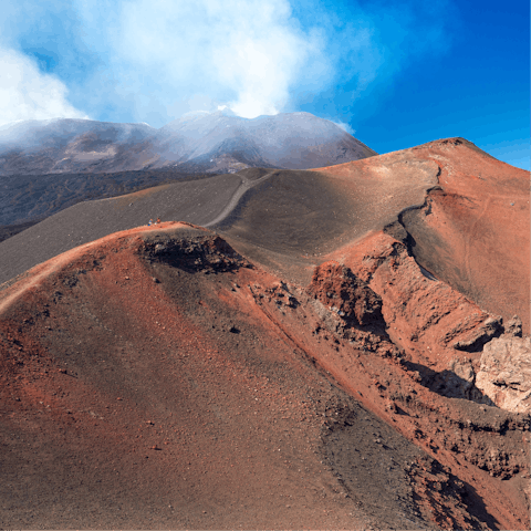 Hike to the summit of Mount Etna – the base is an hour and twenty three minutes away by car