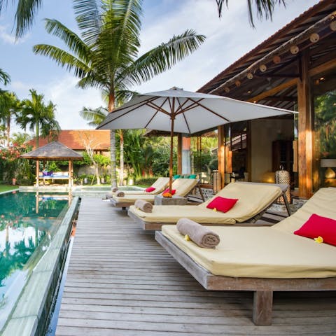 Soak up the Bali sun as the palm trees dance beside you