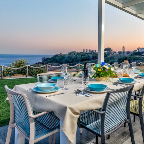 Tuck into alfresco Italian gets on the patio as the sun sets over the ocean