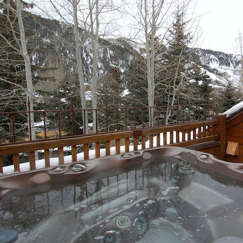 Take in the mountain views from the steaming hot tub