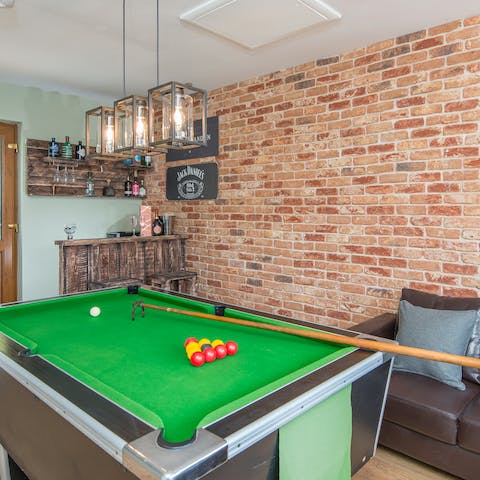 Enjoy a game of billiards in the game room, followed by a glass of whiskey