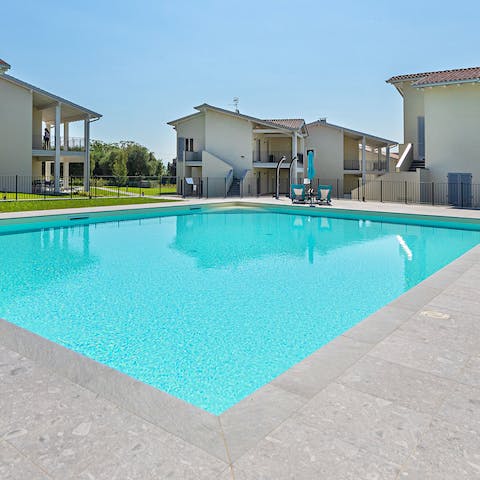 Take a refreshing dip in the shared swimming pool