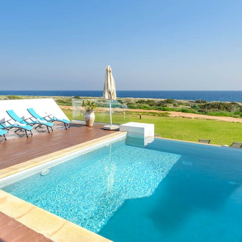 Splash in the private swimming pool with the sea as your backdrop