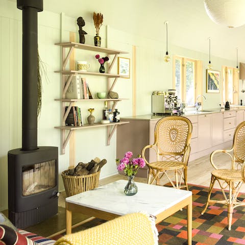 Huddle around the wood-burning stove for a cosy evening inside