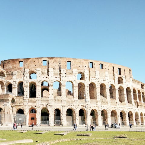 Visit the Colosseum, a thirty-minute walk or a fifteen-minute ride away