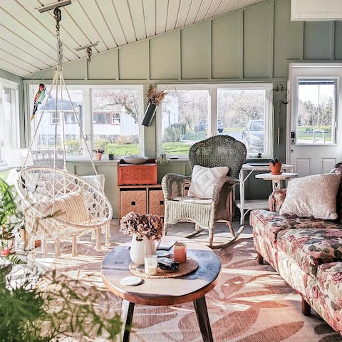 Kick back with a book in the picturesque, light-filled sun room