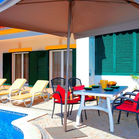 Tuck into breakfast by the pool in the outdoor dining area