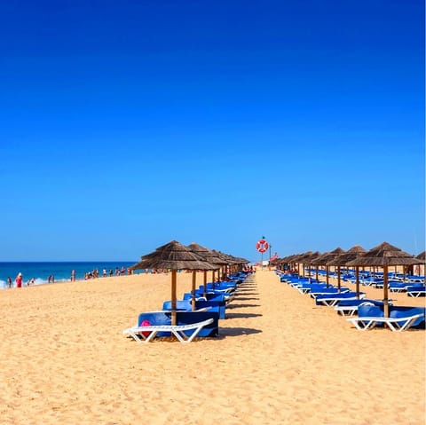 Spend sun-filled days relaxing on Alagoa beach, a ten-minute walk from your villa