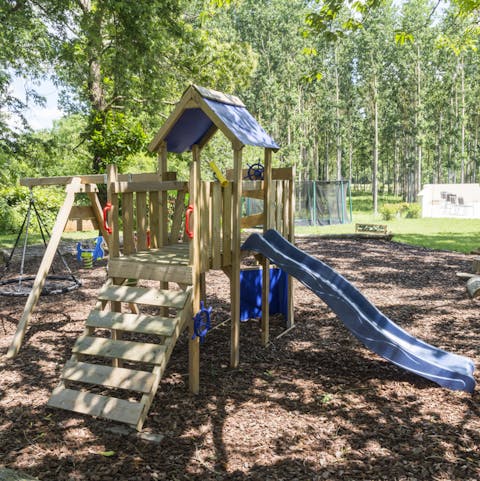 Watch children explore and enjoy the outdoor play areas