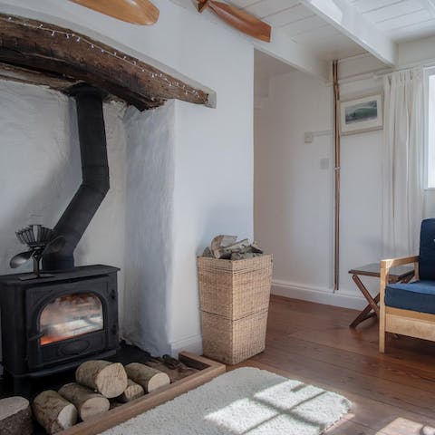 Spend evenings curled up in living space, warmed by the wood-burning stove