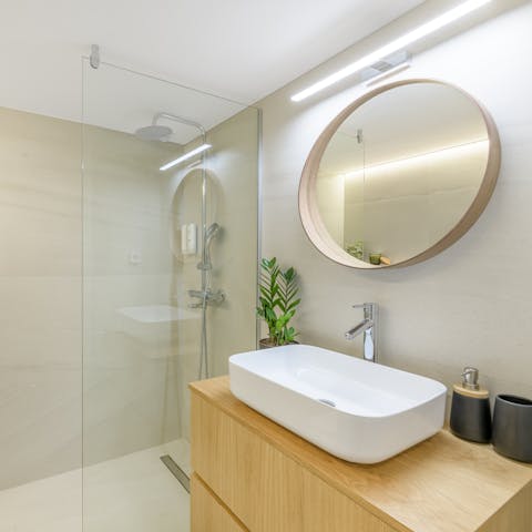 Start mornings with a luxurious soak under the bathroom's rainfall shower