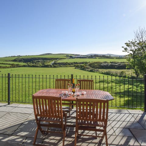 Enjoy stunning views and the tranquillity of the countryside relaxing on your private patio