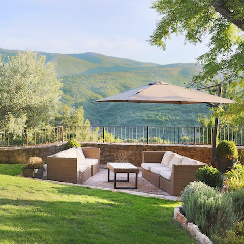 Enjoy peaceful moments at the outdoor lounge area with views of the surrounding landscape