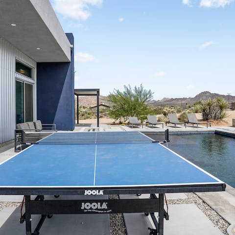 Play a game of poolside ping pong with your friends