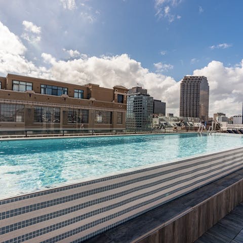Swim lengths in the glistening rooftop pool
