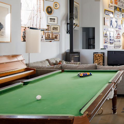 Play a game of snooker or tinkle the ivories on one of two pianos