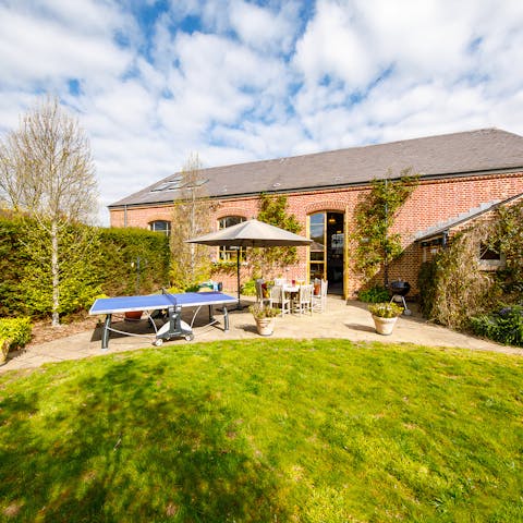 See who is the vacation table tennis champion in the south-facing garden