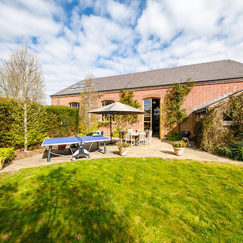 See who is the vacation table tennis champion in the south-facing garden
