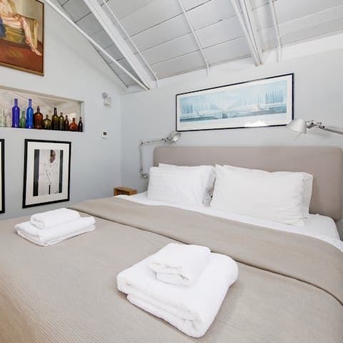 Get some rest in the stylish master bedroom after exploring Chichester