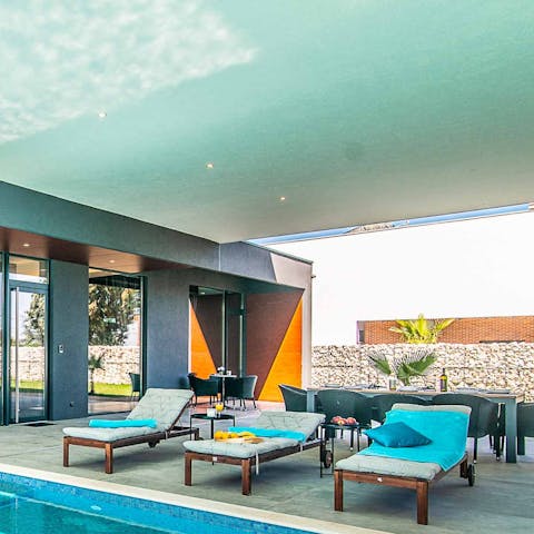 Soak up some vitamin D from the poolside loungers