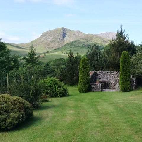 Admire scenic mountain views over Cadair Idris from the garden