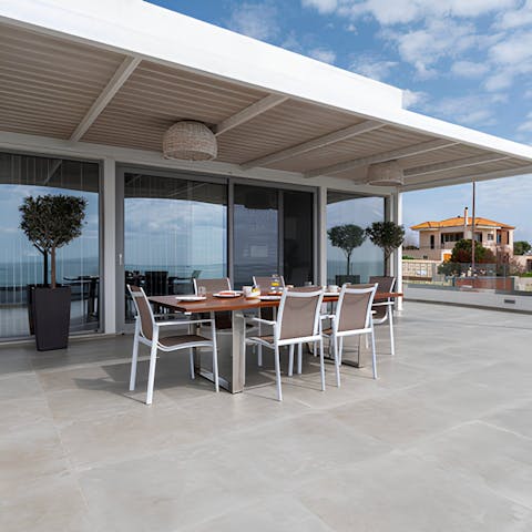 Look forward to dining on Cretan cuisine on the terrace