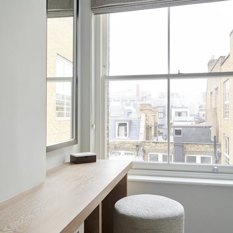 Look out to the rooftops of the city from the dressing table of the bedroom