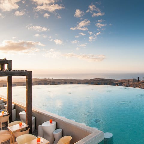 Make sunset cocktails in the shared infinity pool your only firm plan for the day