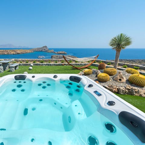 Sink into the hot tub under starry skies