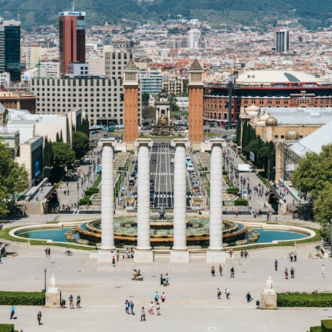 Visit bustling Plaça d'Espanya, an eight-minute walk away