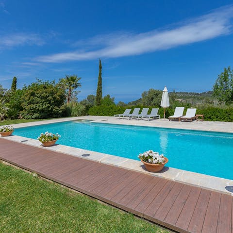 Settle in for a day of sunbathing by the outdoor pool