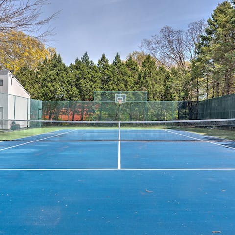 Enjoy a round of tennis or basketball on the private courts
