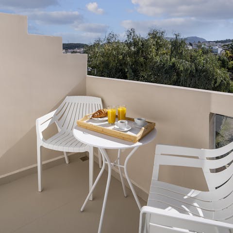 Enjoy your morning coffee on the sunny balcony before heading out to explore