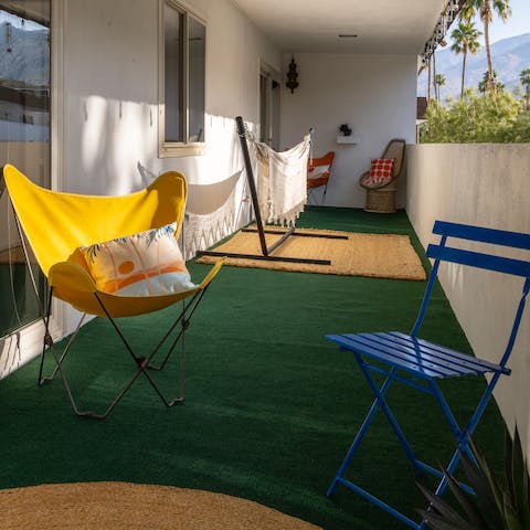 Sink into a seat or stretch out in the hammock out on the balcony