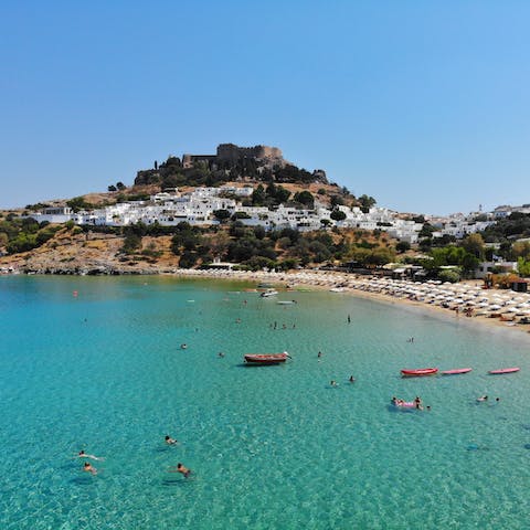 Fall in love with the unique fishing village of Lindos, just half an hour away