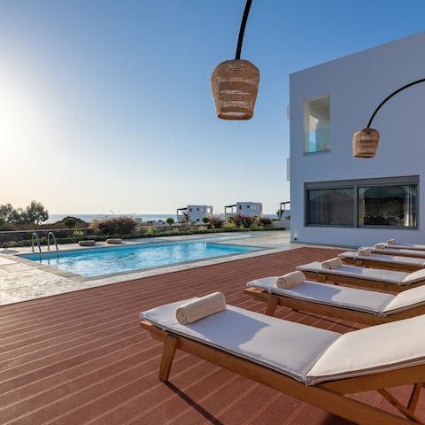 Lounge poolside under the Grecian sun and enjoy your scenic surrounds