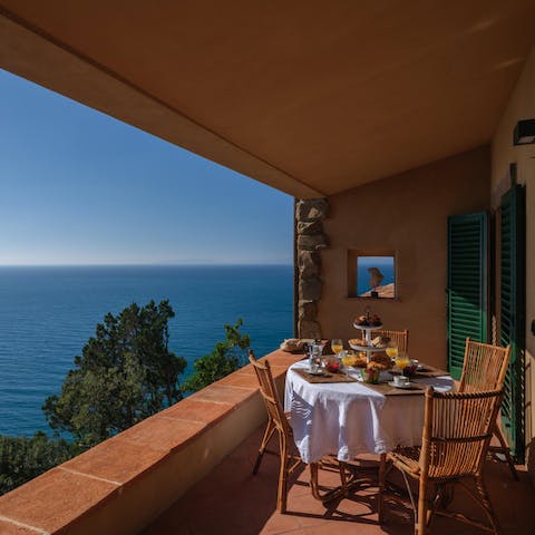 Soak up the sun on the private balcony overlooking the water