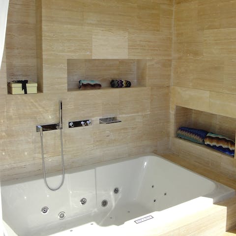 Soak in the deep Jacuzzi bath in the master suite