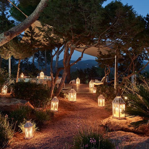 Follow the lanterns through the beautiful gardens for evening drinks