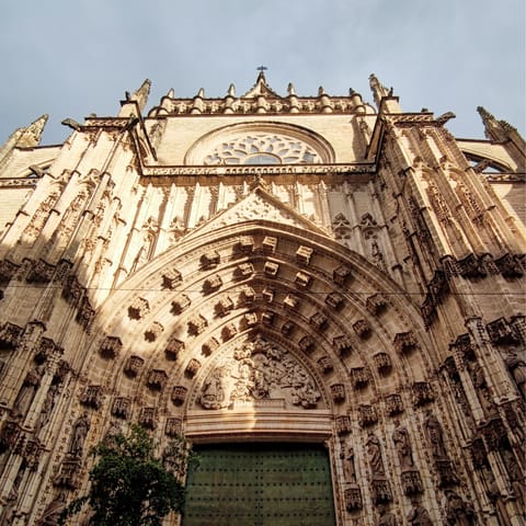 Admire the gothic architecture at Seville Cathedral, one minute away